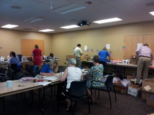 Employees at Medtronic Rice Creek who were busy sorting and checking school supplies and then assembling packets to be distributed during inauguration ceremonies of new Mano a Mano schools! Each packet contains notebooks, folders, markers, crayons, pencils, pens, a pencil sharpener, a pair of scissors, glue, and an eraser. The packets will be greatly appreciated by the young children about to enjoy the extraordinary opportunity of a brand new school. All of these school supplies were donated to Mano a Mano by a number of Twin Cities-area schools and volunteers.