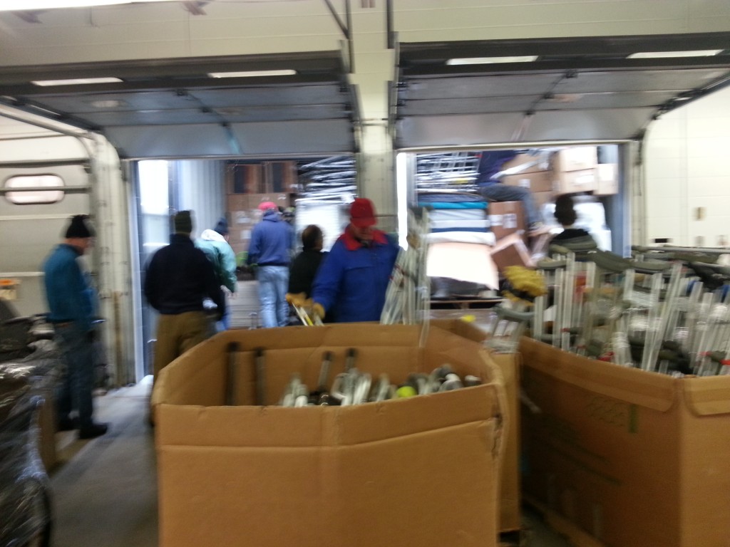 Volunteers loading containers with supplies at the Mano a Mano warehouse to ship to Bolivia in November 2014.