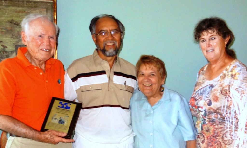 Joe and Charlotte (far left and far right, respectively) with Mano a Mano co-founders Segundo and Joan Velasquez and the dedication plaque for the new clinic!