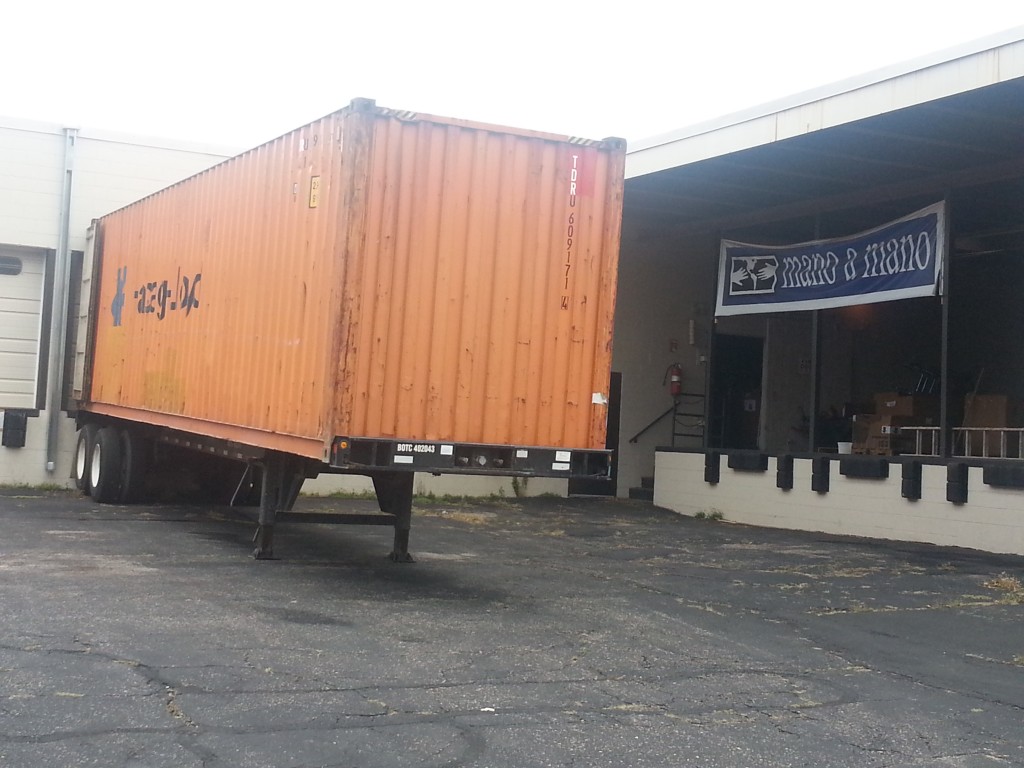 1st container. We always order 'high-cube' with extra space at the top to be able to get more supplies in each container and stretch our dollars as far as possible.