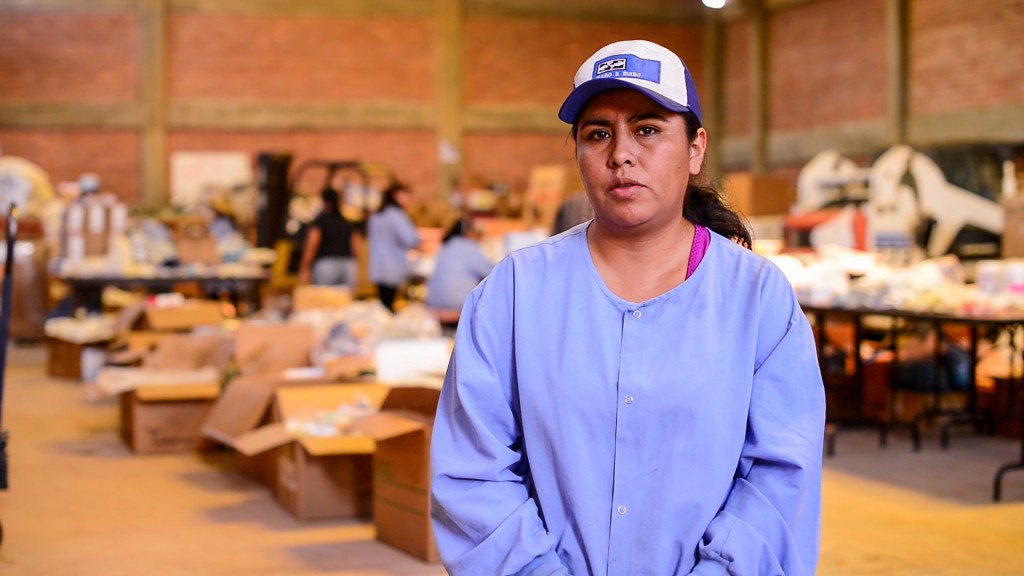 Charo, in Mano a Mano's warehouse in Cochabamba preparing supplies sent from the US for distribution in Bolivia.