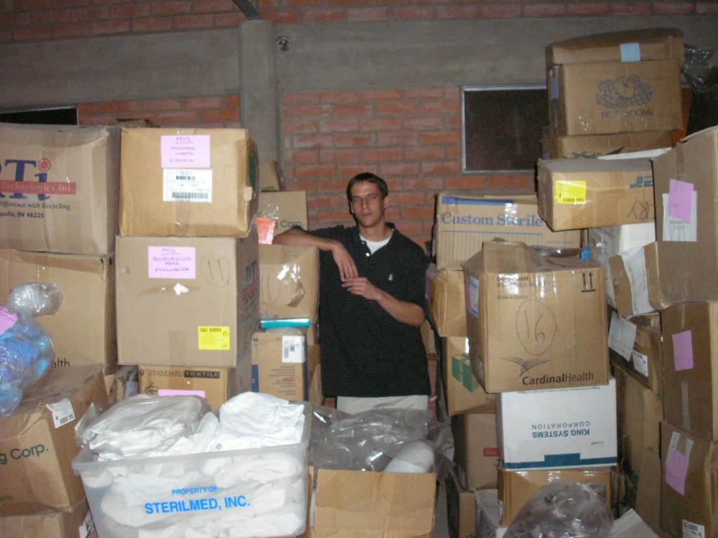 Me among the boxes in Mano a Mano Bolivia's warehouse in Cochabamba in 2006 - I had taped each of these boxes in Minnesota, so it was gratifying to see them in Bolivia!