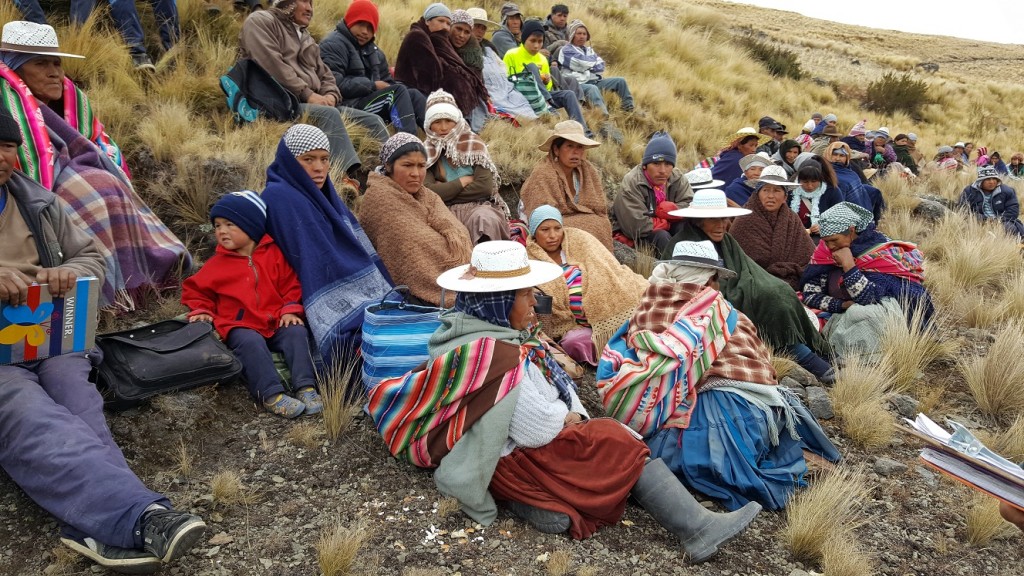 Residents of the Wirkini communty attending a meeting with Mano a Mano - which are held throughout the planning and construction process - at the site of the reservoir.