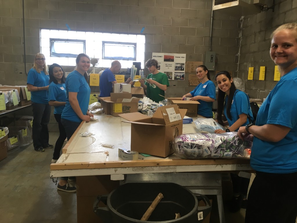 Volunteers from Northwestern Health Sciences University sort donated medical supplies at Mano a Mano on their annual Service & Appreciation Day, June 26, 2018.